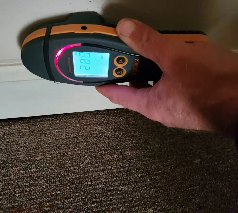 Moisture detection at baseboard during Storm Damage Restoration in Tonganoxie